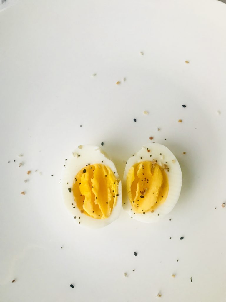 Sliced boiled egg on white plate