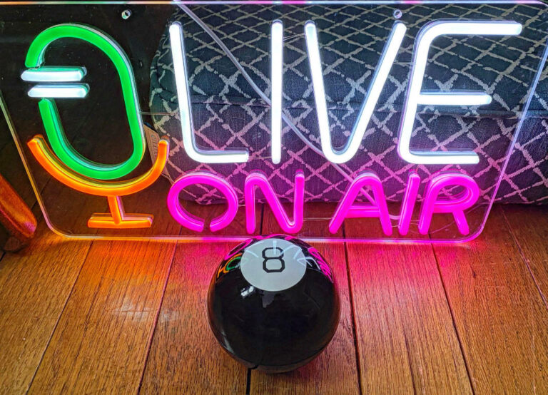 Photo of the Live On Air sign and our Magic 8 Ball.