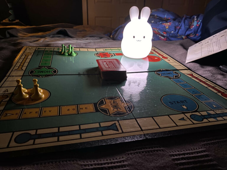 Photo of Michael and Nicole playing Sorry during a power outage.