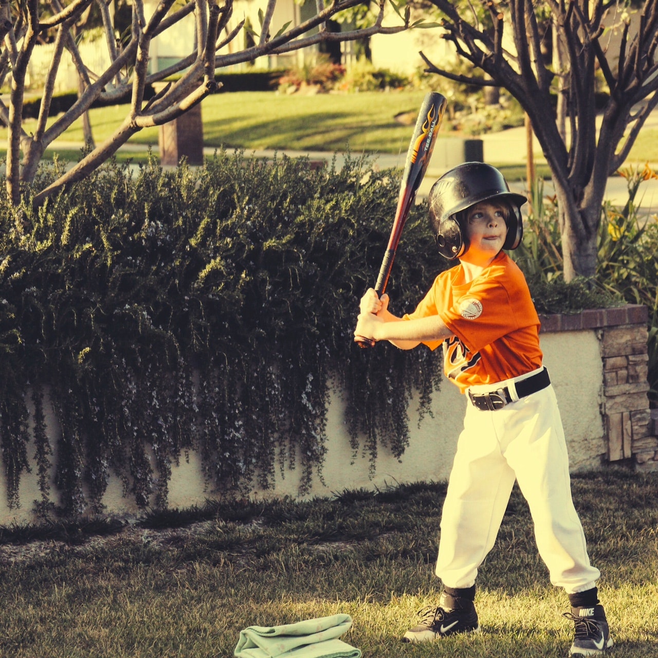 Photo of a kid playing baseball.