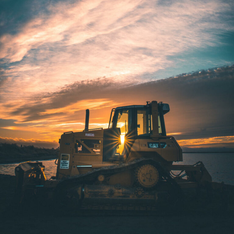 Photo of a bulldozer at sunrise.