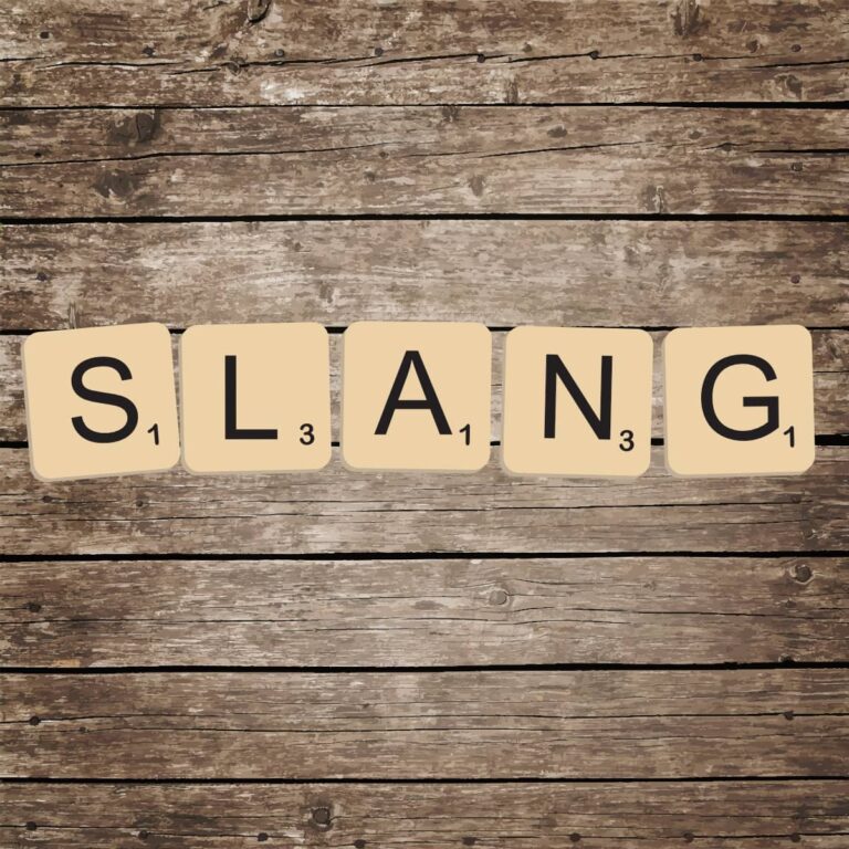 Scrabble tiles spelling the word "slang".